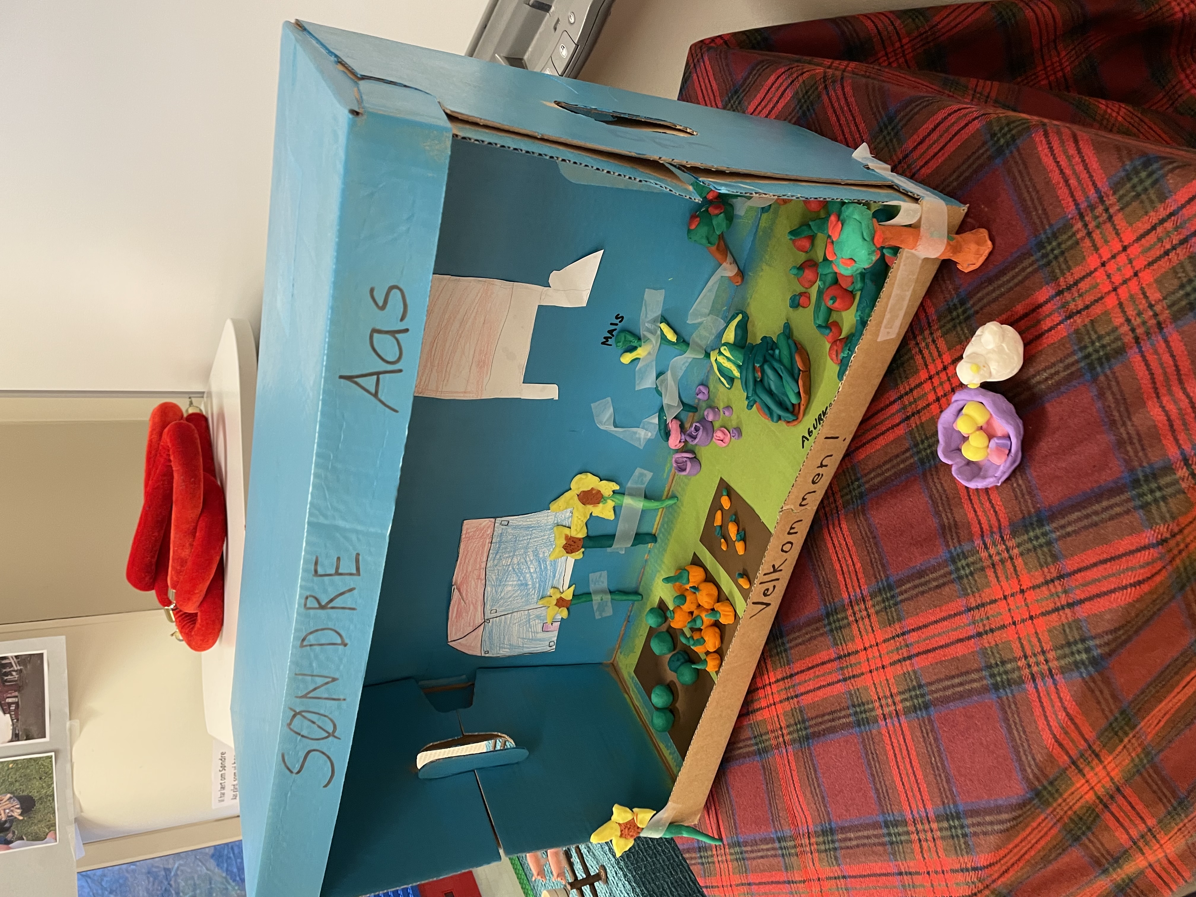 a child's playroom with a table and toys